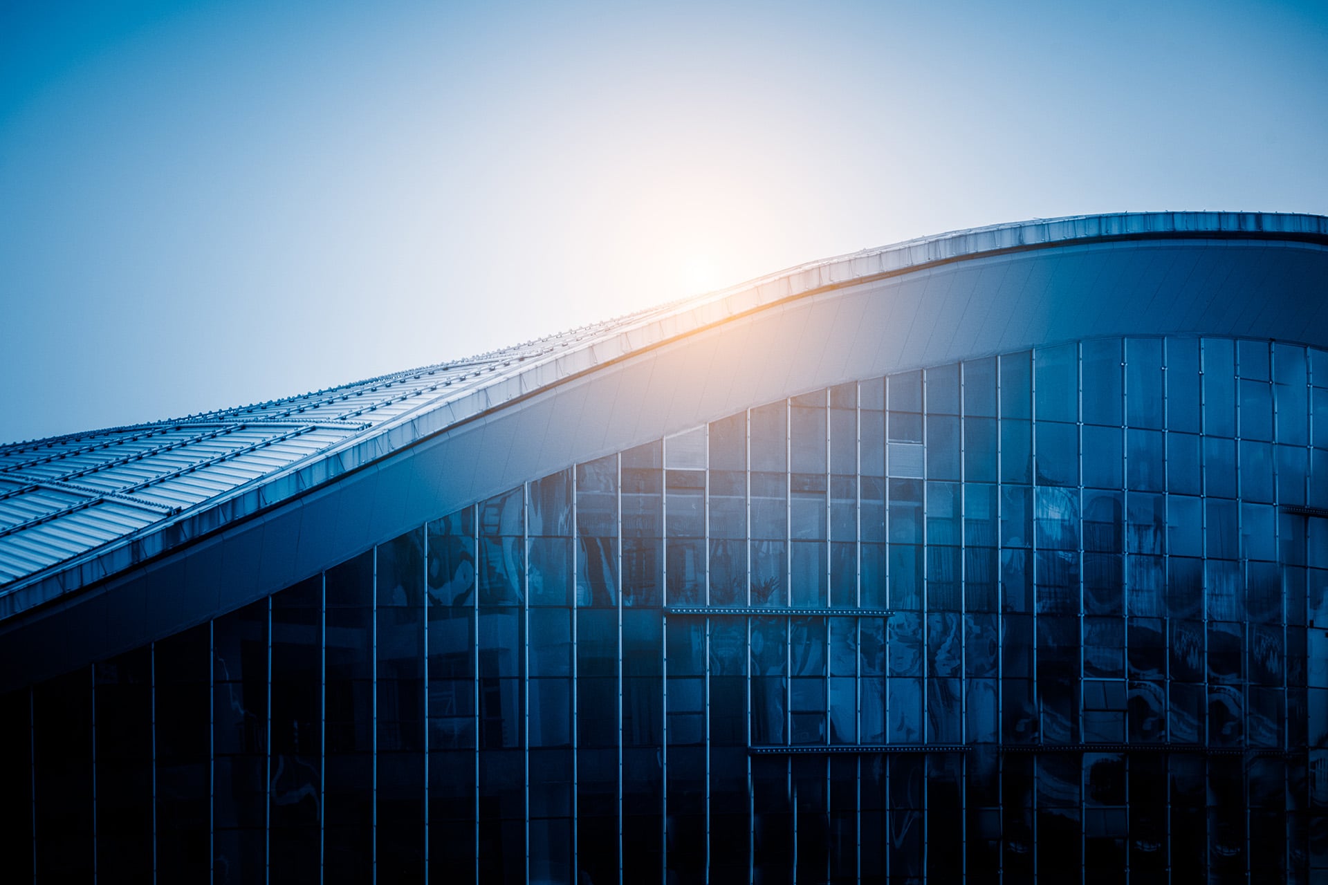 Modern glass building with curved roof